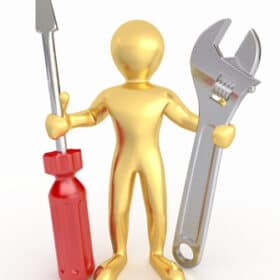 Goldene Figur mit Schraubenzieher und Schraubenschlüssel.